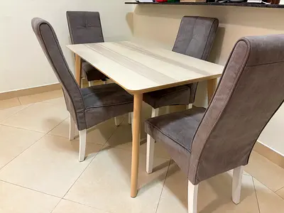 Light wood dining table with 4 upholstered chairs - compact set