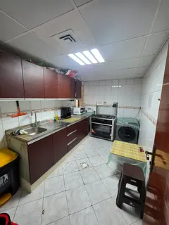 Bed space with a balcony with a fridge