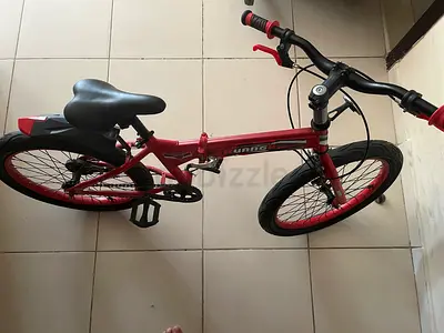 Red kids/teen mountain-style bicycle in good condition