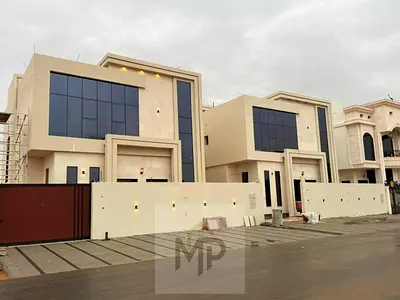 Luxury villa for sale, including registration and ownership fees, near Azha Complex. Featuring a modern design and high-end finishes, this spacious vi