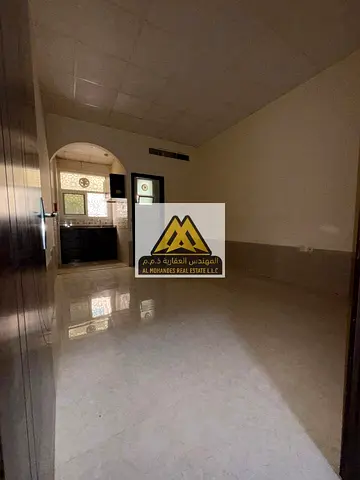 Studio for Annual Rent in Al Jurf 2 Ajman Ground Floor Spacious Layout Semi Separate Kitchen Central AC Prime Location Near University and Services