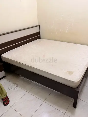 Used wooden bed and matress king size with side table included