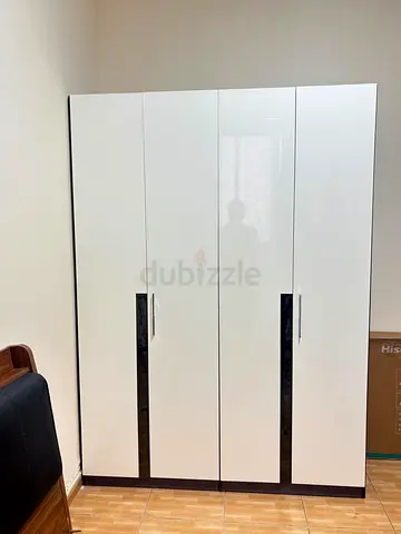 Used 4 Door Wardrobe / Armoire with Hanging Rail and Shelf