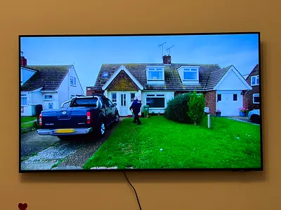 55-inch Samsung LED Smart TV mounted on wall - excellent condition