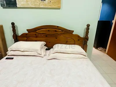 Pure wood bed with side table and dressing table going very cheap