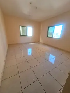 2BR apartment in Al Shuwaiheen, sea view, split AC, AED 30,000 yearly, 4–6 payments.