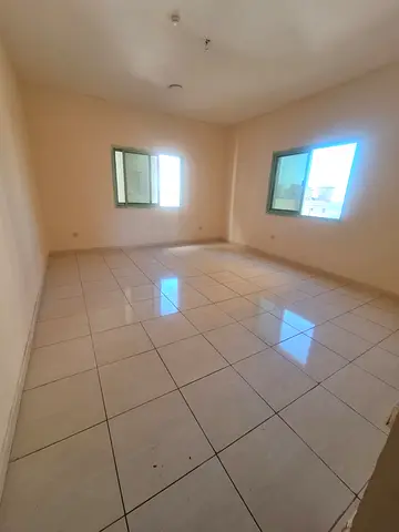 2BR apartment in Al Shuwaiheen, sea view, split AC, AED 30,000 yearly, 4–6 payments.
