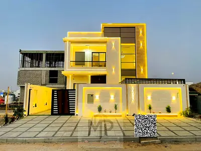 Directly from the owner, including all property fees: A villa in one of Ajman's most luxurious villas, built and finished to super deluxe standards.