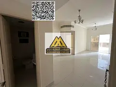 A 2-bedroom apartment with a living room for annual rent in Al Nuaimiya 1 – Ajman, featuring 2 bat