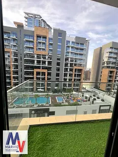 1BR Apartment | Azizi Riviera 65 | Pool &amp; Downtown View | Balcony
