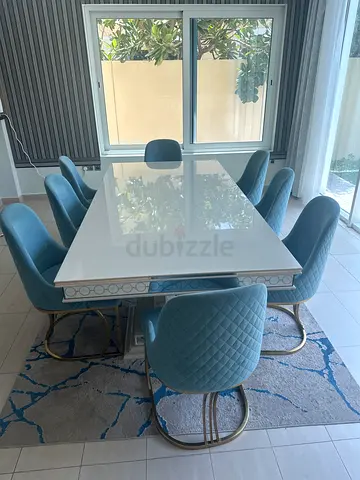 White Marble-Top Dining Table with 6 Blue Quilted Chairs