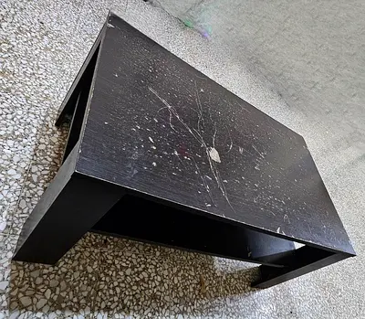 Low black wooden coffee table with storage