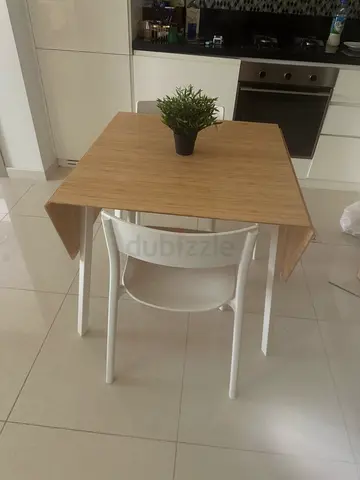 Compact wooden dining table with four chairs - light oak finish
