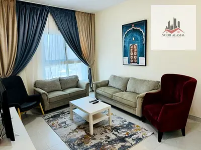 Sharjah, Al Taawun area: Two-bedroom apartment with a living room, kitchen, two bathrooms, and a balcony. Second tenant. Super deluxe furnishings.