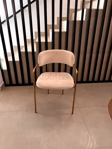 Cream accent chair with gold metal frame