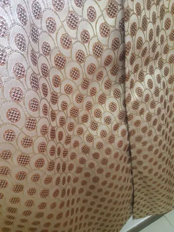 Beige patterned blackout curtains with hanging rods — pair in good condition
