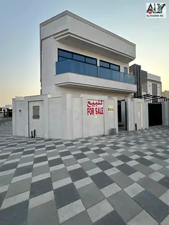 Own a villa in Al Bahia, Ajman, including registration fees, corner of two streets, ground floor, fi