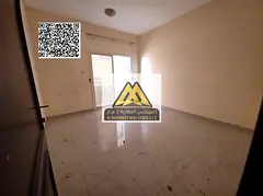 A spacious 1-bedroom apartment with a living room for annual rent in Al Hamidiya – Ajman, featurin
