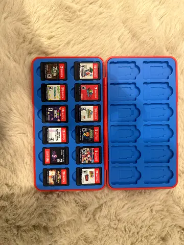 Nintendo Switch game cartridge collection with storage case (14 games)