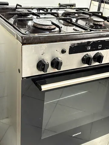 Used stainless steel gas range with oven (4 burners) - working condition