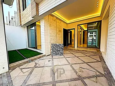 For sale villa - two floors & a large yard - close to Sheikh Mohammed bin Zayed Street - free ownership for all nationalities for life - with the possibility of easy bank financing