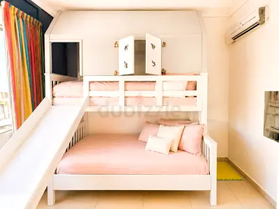 Custom-made house bunk bed + slide and mattresses – AED 1,500 slightly negotiable