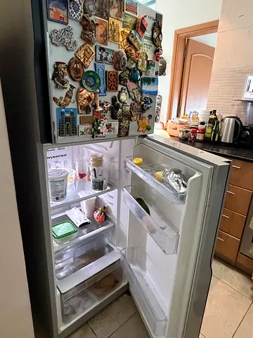 Used Double-Door Refrigerator (working). magnets not included. Available from 18th May