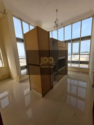 Al-Salama area, one-bedroom apartment with a living room, close to essential services.