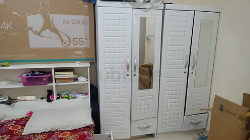 White 4-Door Wardrobe and cot with Mirror and Drawers (full bedroom set) - Good Condition