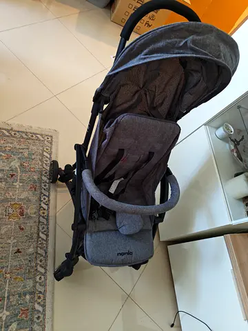Lightweight grey Nania stroller in good condition, plane cabinet friendly
