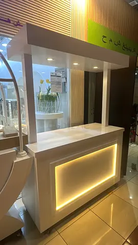 White display shelving unit with integrated LED lighting