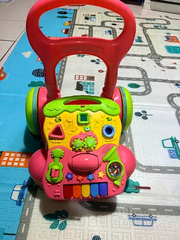 Pink baby push walker with activity panel - good condition