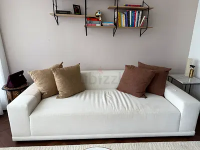 Three-seater white fabric sofa in very good condition from CB2. Barely used. With pillows for free.