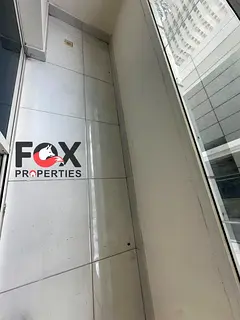 1BHK master in Rashidiya 1, 2 bathrooms, balcony, central AC, AED 32K with parking or 31K without.