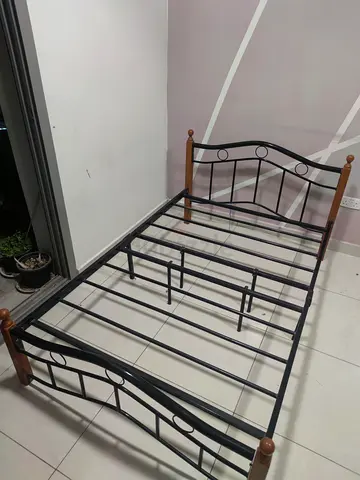 Single metal bed frame with wooden posts - good condition