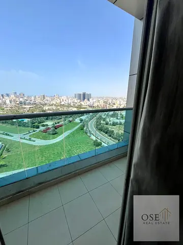 Two-bedroom apartment with a living room and an open view overlooking all of Ajman, furnished and with parking.