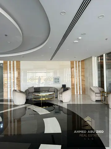 Two-bedroom apartment with a living room in Gulf Tower directly on Mohammed bin Zayed Street, 2 bathrooms, balcony, free parking, 38,000 AED per year,