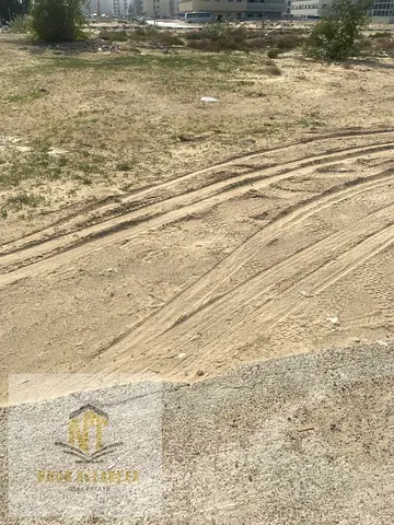 Land for sale in Al Matraq, ideally located as the second plot from a main road with a wide 97-meter frontage. The property is in a prime location clo