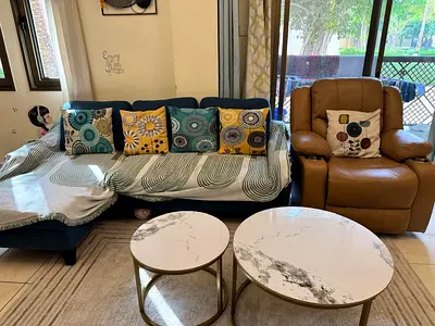 Blue L-shape Sofa and Marble Nesting Coffee Tables