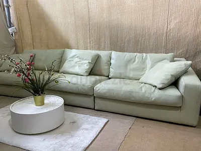 Stylish white leather sectional sofa in could feather 🪶