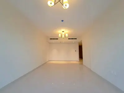 The most luxurious and beautiful two-bedroom apartment with a living room and maid's room in Sharjah, Tala City. Central air conditioning, free parkin