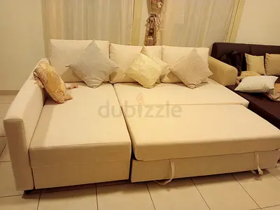 Beige L-shaped Sofa Bed with Cushions — Good Condition