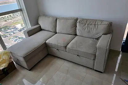 Light grey L-shaped 3-seater sofa with chaise lounge