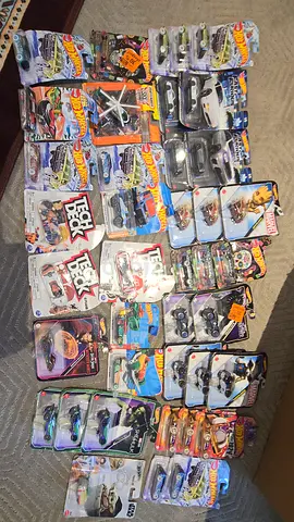 Large lot of unopened Hot Wheels and toy vehicles - mixed set