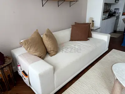 Three-seater white fabric sofa in very good condition from CB2. Barely used. With pillows for free.