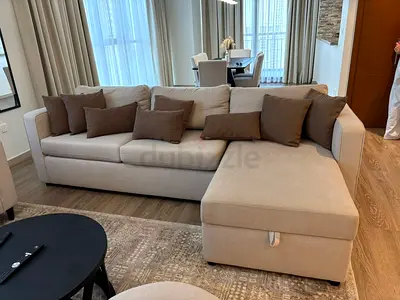 Light beige L-shaped fabric sofa with chaise - like new condition