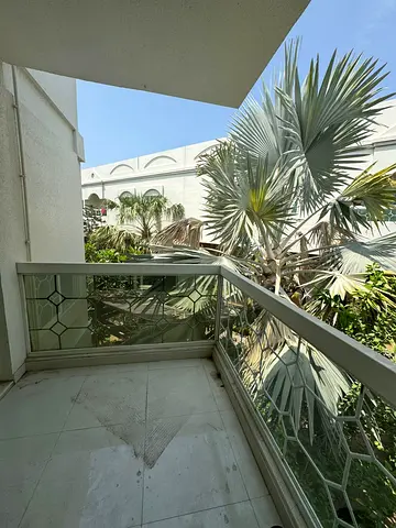 The most luxurious and distinctive apartment for rent in Sharjah Al Khan, featuring two bedrooms, two living rooms, three bathrooms, a garden, and a k