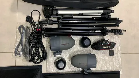 studio lighting kit includes soft light boxes, stands, lamps, a carrying case, (Almost new)