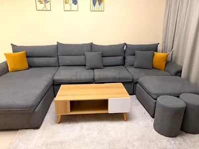 Large sofas with a free coffee table and rug included.