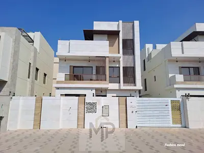 Villa for sale at ajman|Al Bahia area|5 master rooms,majlis, 2 halls, maid room, roof|freehold | 0 registration fees.